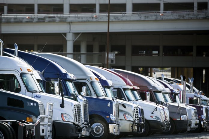 ON SUNDAY, police nationwide began enforcing rules requiring most big rigs to use electronic logging devices to record driver hours. / BLOOMBERG FILE PHOTO/T.J. KIRKPATRICK