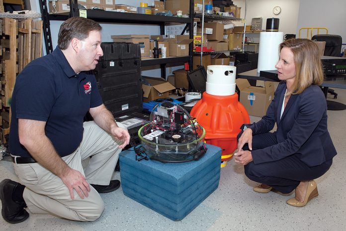 A SIGNIFICANT BOOST: Small businesses such as MIKEL, headed by President Kelly Mendell, right (with Dave Lambert, engineer and program manager), who was named Rhode Island’s Small Business Person of the Year by the U.S. Small Business Administration, employ more than half of all private-sector workers in the state.  / PBN PHOTO/KATE WHITNEY LUCEY
