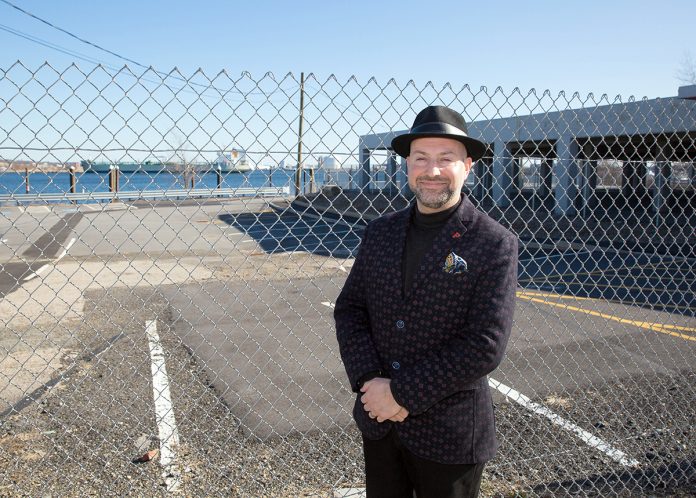 CENTRAL LOCATION: David Dadekian, owner and founder of Eat Drink RI, stands in front of the site of the former Shooters nightclub at 25 India St. in Providence, where he has proposed to create Central Market, a retail center where the public can gather and experience the best of the state’s small food-production businesses.  / PBN PHOTO/TRACY JENKINS