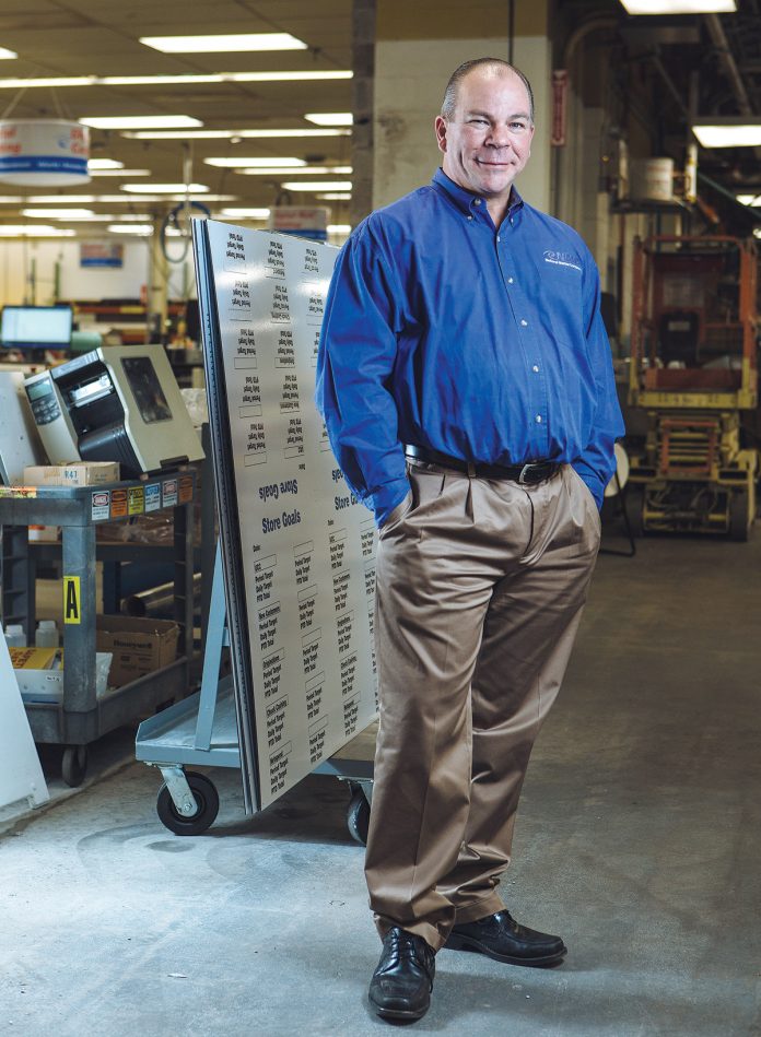 After serving as national sales manager for National Marker Co., Michael J. Black bought the manufacturer of safety signs, tags and labels in 2012. And while he has increased innovation and production, he is very happy to invest in his people. / PBN PHOTO/RUPERT WHITELEY