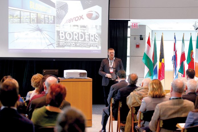 TRADE DISCUSSION: Cris Beswick, director of innovation consulting at Culture Consultancy, strategic adviser on innovation at Wazoku and a visiting fellow at Cranfield School of Management and the Centre for Customised Executive Development in England, speaks during last year’s annual World Trade Day at Bryant University. The university will host the 33rd annual World Trade Day on May 23. / COURTESY BRYANT UNIVERSITY