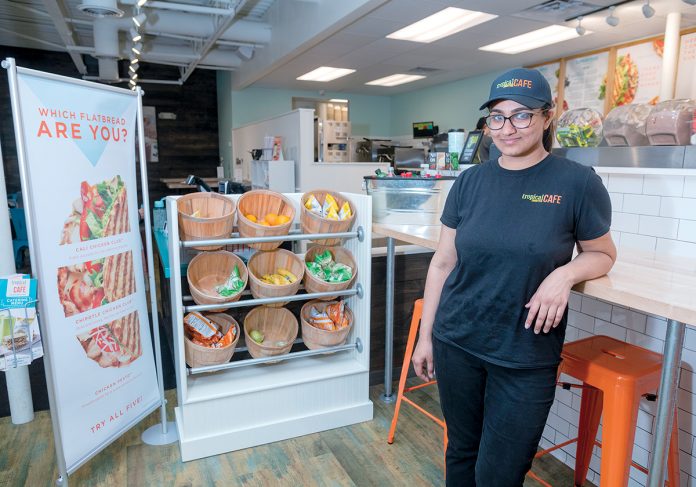 DOUBLE DUTY: Sneha Sabnani is the owner of both Tropical Smoothie Cafe franchises in Rhode Island. She is pictured above at the Thayer Street location in Providence. A third franchise of the fast-casual restaurant is slated to open in Cranston this summer. / PBN PHOTO/MICHAEL SALERNO DOUBLE DUTY: Sneha Sabnani is the owner of both Tropical Smoothie Cafe franchises in Rhode Island. She is pictured above at the Thayer Street location in Providence. A third franchise of the fast-casual restaurant is slated to open in Cranston this summer. / PBN PHOTO/MICHAEL SALERNO