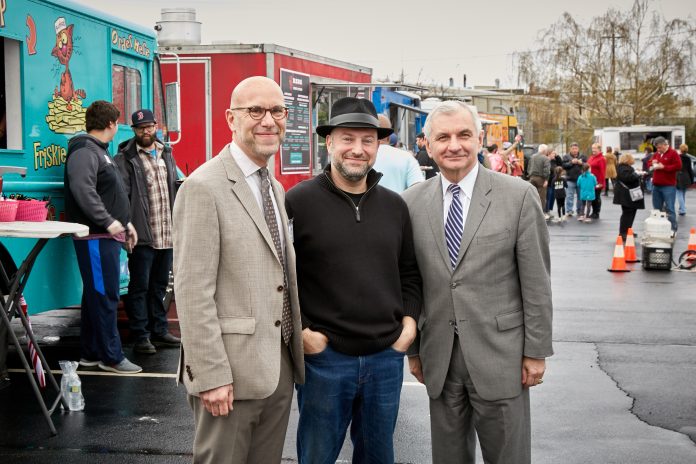 THE SIXTH ITERATION OF THE EAT DRINK RHODE ISLAND TRUCK STOP netted more than $150,000 for the R.I. Community Food Bank on Friday, April 27. Left to Right: Andrew Schiff, CEO of the food bank, David Dadekian, EDRI's owner and founder, and Se. Jack Reed. / COURTESY R.I. COMMUNITY FOOD BANK THE SIXTH ITERATION OF THE EAT DRINK RHODE ISLAND TRUCK STOP netted more than $150,000 for the R.I. Community Food Bank on Friday, April 27. Left to Right: Andrew Schiff, CEO of the food bank, David Dadekian, EDRI's owner and founder, and Se. Jack Reed. / COURTESY R.I. COMMUNITY FOOD BANK