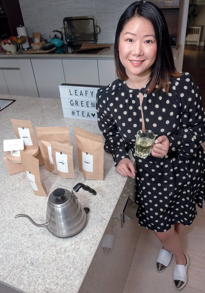 ARTISAN TEA: Michelle Cheng, owner and founder of Leafy Green, a tea company based out of Hope & Main in Warren, prioritizes single-origin tea leaves purchased directly from farmers to elevate her tea to “artisan status.” / PBN PHOTO/MICHAEL SALERNO