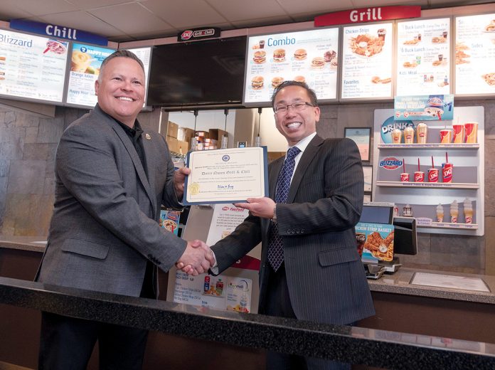 GRAND OPENING: DQ Grill and Chill co-owner Will Dailey, left, receives an official certificate from Cranston Mayor Allan Fung celebrating the grand opening of the restaurant. / PBN PHOTO/MICHAEL SALERNO GRAND OPENING: DQ Grill and Chill co-owner Will Dailey, left, receives an official certificate from Cranston Mayor Allan Fung celebrating the grand opening of the restaurant. / PBN PHOTO/MICHAEL SALERNO