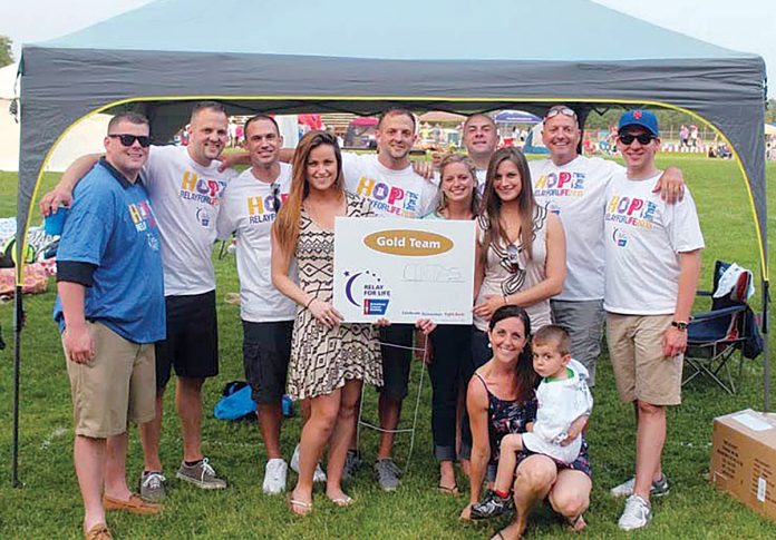 RELAY TEAM: Cintas employees take part in the American Cancer Society’s 2015 Hope Relay for Life. The Rhode Island chapter of the American Cancer Society will hold its 10th annual Relay for Life of Greater Westerly June 29-30 at Westerly High School.  / COURTESY CINTAS