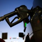 GAS PRICES IN RHODE ISLAND and Massachusetts both declined this week by a few cents, but remain significantly higher than they were one year ago. / BLOOMBERG FILE PHOTO/LUKE SHARRETT
