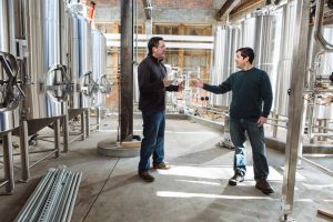 CO-FOUNDERS OF ISLE BREWERS GUILD, Jeremy Duffy (left) and Devin Kelly, announced Thursday a three-part expansion of the craft brewing cooperative. / PBN FILE PHOTO / BY RUPERT WHITELEY