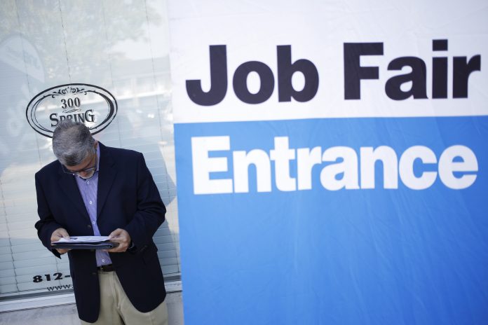 THE NON-SEASONALLY ADJUSTED UNEMPLOYMENT RATE in the Providence metro area declined 0.2 percentage points year over year in May to 3.9 percent. / BLOOMBERG FILE PHOTO/LUKE SHARRETT