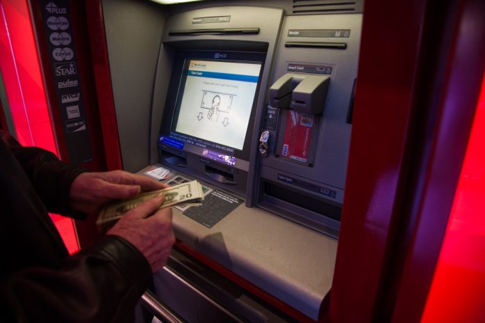 SOME TOURISM LEADERS in the state believe that ATM-use data could help the industry better understand who is visiting Rhode Island. / BLOOMBERG FILE PHOTO/DANIEL TEPPER