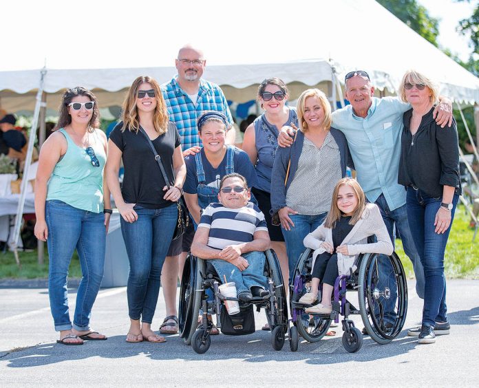 EMPOWERED: Employees gather outside Dominion Diagnostics’ North Kingstown headquarters to celebrate the company’s 20th anniversary. / COURTESY DOMINION DIAGNOSTICS LLC