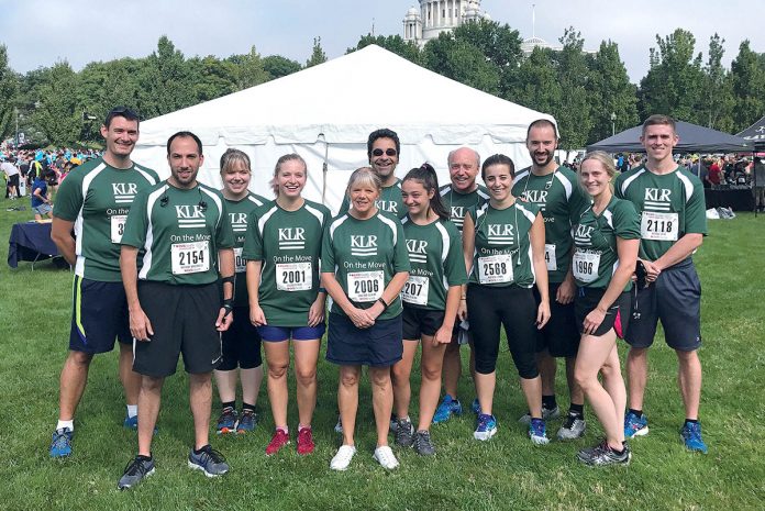 CHARITY RUN: Khan, Litwin, Renza employees team up for the CVS Downtown 5K charity run in Providence in September 2017.  / COURTESY Kahn, Litwin, Renza & Co. Ltd.