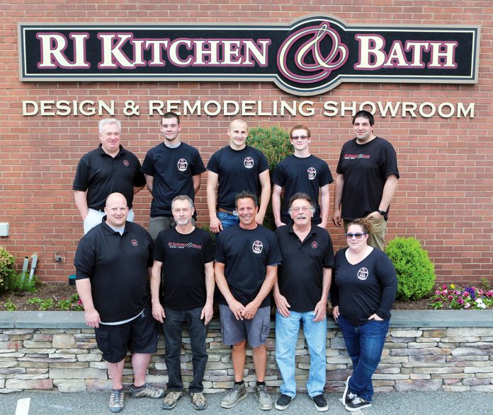 SOCIAL AND CHARITABLE: Rhode Island Kitchen & Bath employees outside their Warwick office in May.   / COURTESY RHODE ISLAND KITCHEN & BATH