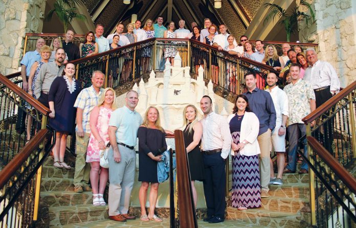 SOUTHERN COMFORTS: Starkweather & Shepley employees at the 9th Annual “Nat Calamis Sales Leaders’ Trip” at a Florida resort in March.  / COURTESY STARKWEATHER & SHEPLEY INSURANCE BROKERAGE INC.