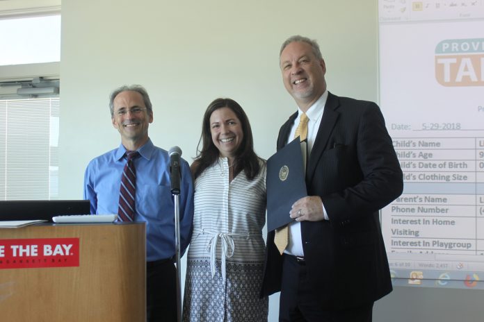 THE PROVIDENCE COMMUNITY HEALTH CENTERS recently received a Citizen Citation from Providence Mayor Jorge O. Elorza for the organization’s ongoing efforts to improve childhood literacy through collaboration with the Providence Talks program. From left, Dr. Andrew Saal, chief medical officer at PCHC; Melissa Menders, executive director for Providence Talks; and Merrill Thomas, CEO at PCHC. / COURTESY PROVIDENCE MAYOR’S OFFICE