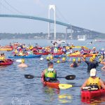 Swimmers and kayakers in the fourth wave of the 40th Save The Bay Swim in August 2016 get ready to start their 1.7-nautical-mile challenge from Newport to Jamestown. The 42nd annual event will take place Saturday, Aug. 4. / COURTESY SAVE THE BAY