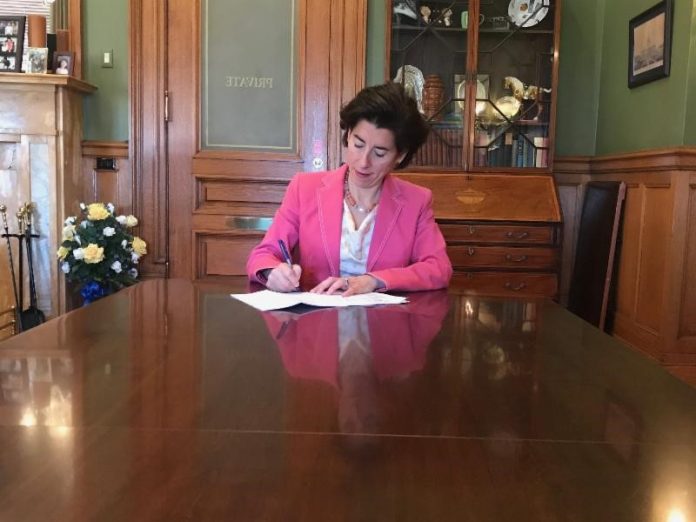 GOV. GINA M. RAIMONDO signed legislation that is designed to incentivize defendants in class action lawsuits related to the St. Joseph pension plan to settle. / COURTESY OFFICE OF GOV. GINA M. RAIMONDO