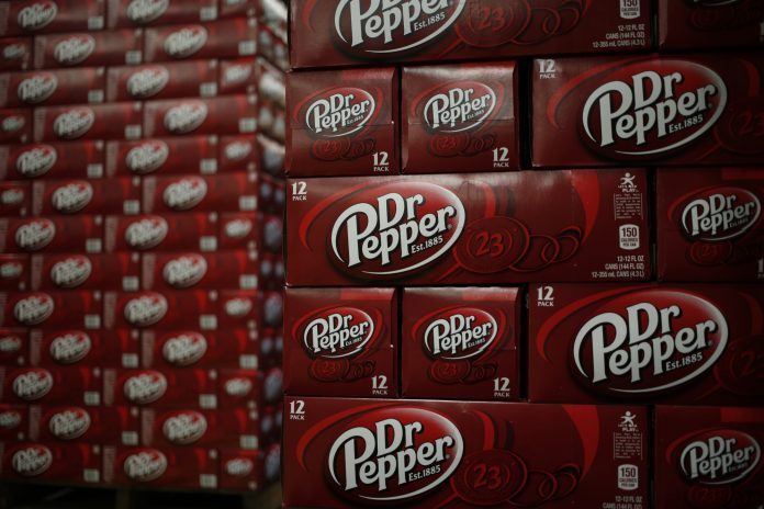 A NATIONAL SALES executive for Dr. Pepper/Seven Up Inc., a subsidiary of Dr. Pepper Snapple Group, was sentenced to 33 months in federal prison for $1.7 million in fraud against Dr. Pepper and federal tax evasion on those earnings. / BLOOMBERG FILE PHOTO/LUKE SHARRETT