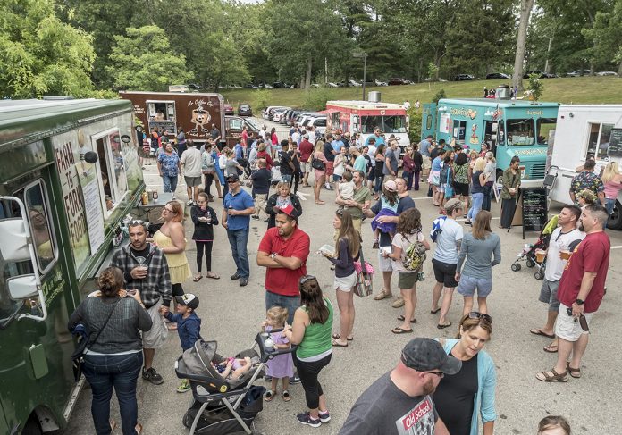 FEEDING A NEED: The recent removal of the requirement that certain food trucks register in every municipality they operate in has the potential to grow the sector, with events such as this 2016 Food Truck Friday in Roger Williams Park happening in more places across the state.   / PBN FILE PHOTO/ MICHAEL SALERNO