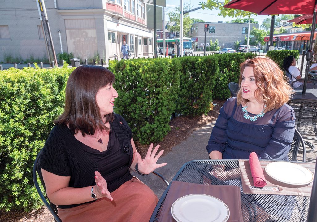 ENTICING OFFER: Stephanie P. Fortunato, left, Providence’s director of arts, culture and tourism, and Kristen Adamo, Providence Warwick Convention & Visitors Bureau vice president of marketing and communications, say the goal of the PWCVB’s recently launched online Providence neighborhood guide is to provide as much information as possible to entice potential tourists to visit.  / PBN PHOTO/MICHAEL SALERNO