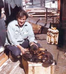 PRIZE CATCH: The Newport Lobster Shack last month renamed its pavilion in honor of Ronnie Fatulli, a longtime lobsterman pictured above in 1979 with a 30-pound lobster.  / COURTESY NEWPORT LOBSTER SHACK