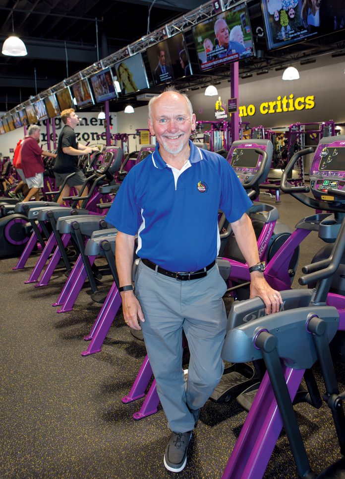 SECOND CAREER: Steve Eddleston, who used to work as a computer engineer, turned his passion for jogging into a second career. He now owns 14 Planet Fitness locations in Rhode Island and Bristol County, Mass.  / PBN PHOTO/KATE WHITNEY LUCEY