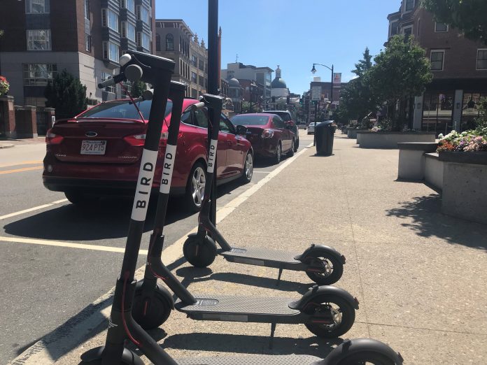 MOTORIZED scooters from the company Bird Rides that can be picked up and left behind anywhere appeared in Providence Friday. The city, which had not been informed of the scooter's arrival, said it was devising a policy on the scooters. / PBN PHOTO/CHRIS BERGENHEIM