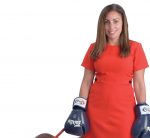 the prop: Rebecca Plonsky’s dog’s name is Gronk – after Rob Gronkowski of the Patriots. “We rescued him five years ago.” The boxing gloves for muay thai kickboxing help her to stay humble and healthy. / PBN PHOTO/MIKE SKORSKI