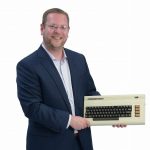 the prop: A Commodore VIC-20, from the original box. It sits on Jeff Wilhelm’s desk and reminds him not to look back but to look forward because technology moves so quickly.   / PBN PHOTO/MIKE SKORSKI