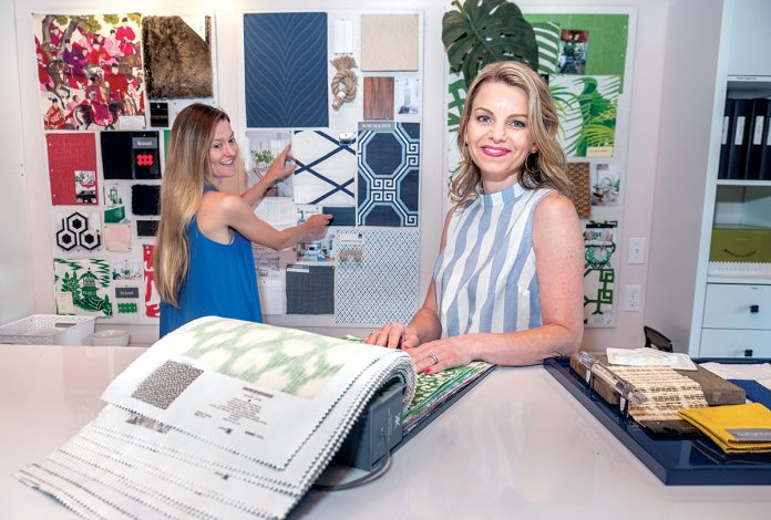 DESIGNING DUO: Janelle Blakely Photopoulos, right, owner and principal interior designer at Blakely Interior Design, with Bernadette Heydt, designer, in their studio in North ­Kingstown.  / PBN PHOTO/MICHAEL SALERNO