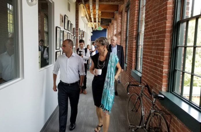 THE PROVIDENCE Business Loan Fund has lent $2.4 million in 11 loans in the last three years. Above, Mayor Jorge O. Elorza and Dr. Anne S. DeGroot, CEO and chief sience officer of EpiVax, Inc., a previous recipient of the PBLF. / COURTESY CITY OF PROVIDENCE
