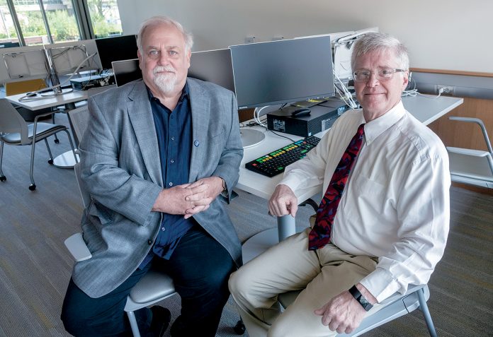 TRAINING NEEDED: UMass Dartmouth professors Tim Shea, left, associate professor ­marketing/business information systems, and Steve White, professor of marketing and international business, oversaw a cybersecurity survey that found employee training lacking.  / PBN PHOTO/MICHAEL SALERNO