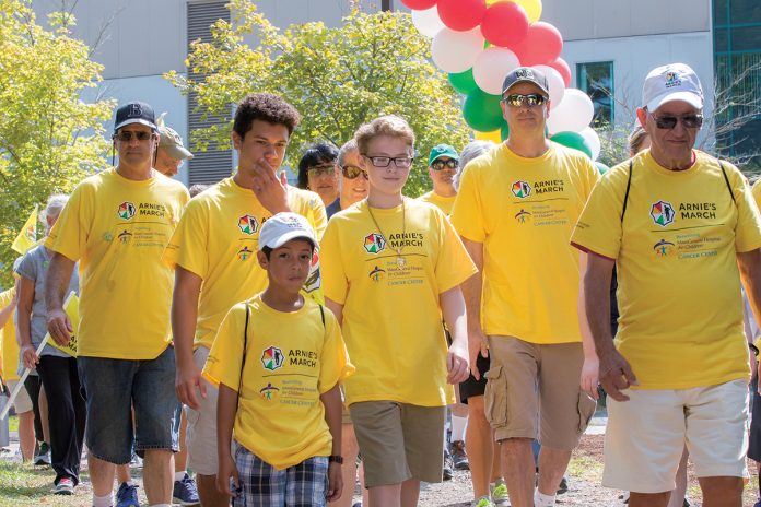 MARCHING AGAINST CANCER: Participants walk during last year’s Arnie’s March Boston event at TPC Boston in Norton. This year’s event, benefiting the Massachusetts General Hospital for Children’s Cancer Center, will take place Aug. 25 from 9:30 a.m. to noon.  / COURTESY ARNIE’S MARCH BOSTON