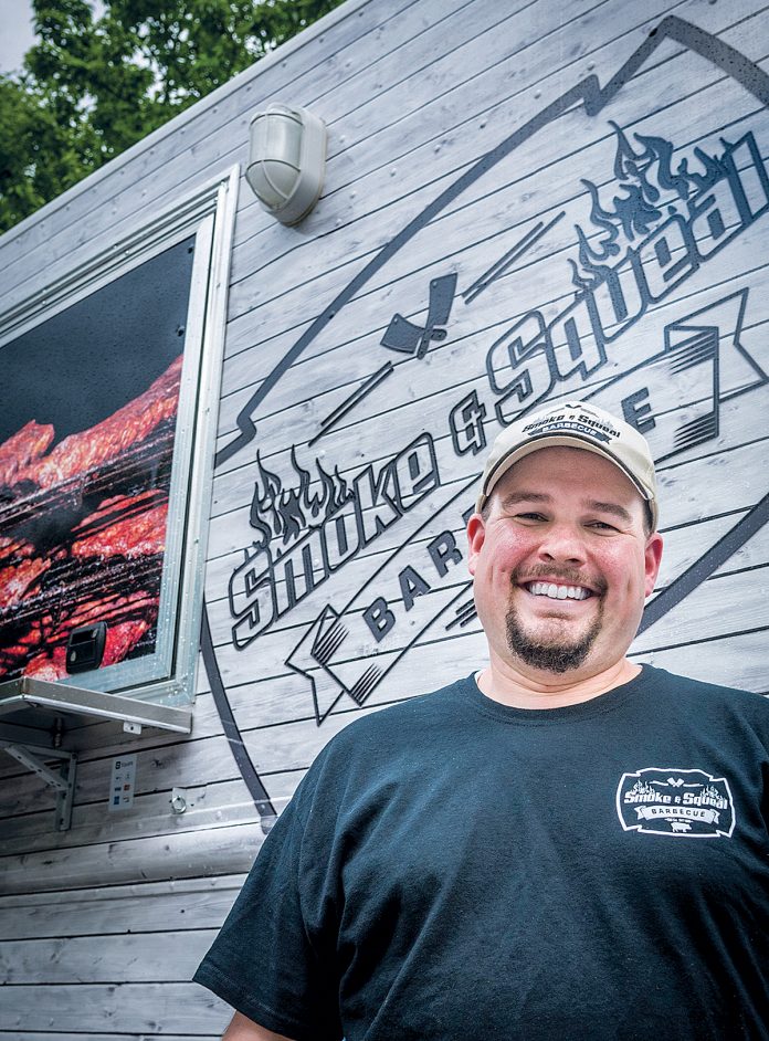 MUCH ­HAPPIER NOW: Smoke & Squeal BBQ owner Adam Batchelder is looking forward to the new year, when licensing requirements for food trucks will be simplified thanks to new regulations.   / PBN FILE PHOTO/ MICHAEL SALERNO