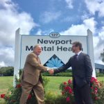 NEWPORT MENTAL HEALTH CEO Jamie Lehane, left, shakes hands with NMH Chief Finance and Administrative Officer Jason Costa after the organization received word of $213,000 in grants. /COURTESY NEWPORT MENTAL HEALTH