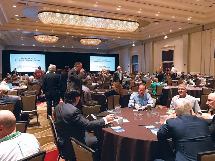 TALKING INFRASTRUCTURE: Attendees have conversations with one another during last year’s Rhode Island Infrastructure Summit at the Omni Providence Hotel. This year’s summit, hosted by the R.I. Infrastructure Bank, will take place Monday, Sept. 17, at the R.I. Convention Center in Providence. x / growth since 2011. PBN PHOTO/MICHAEL SALERNO