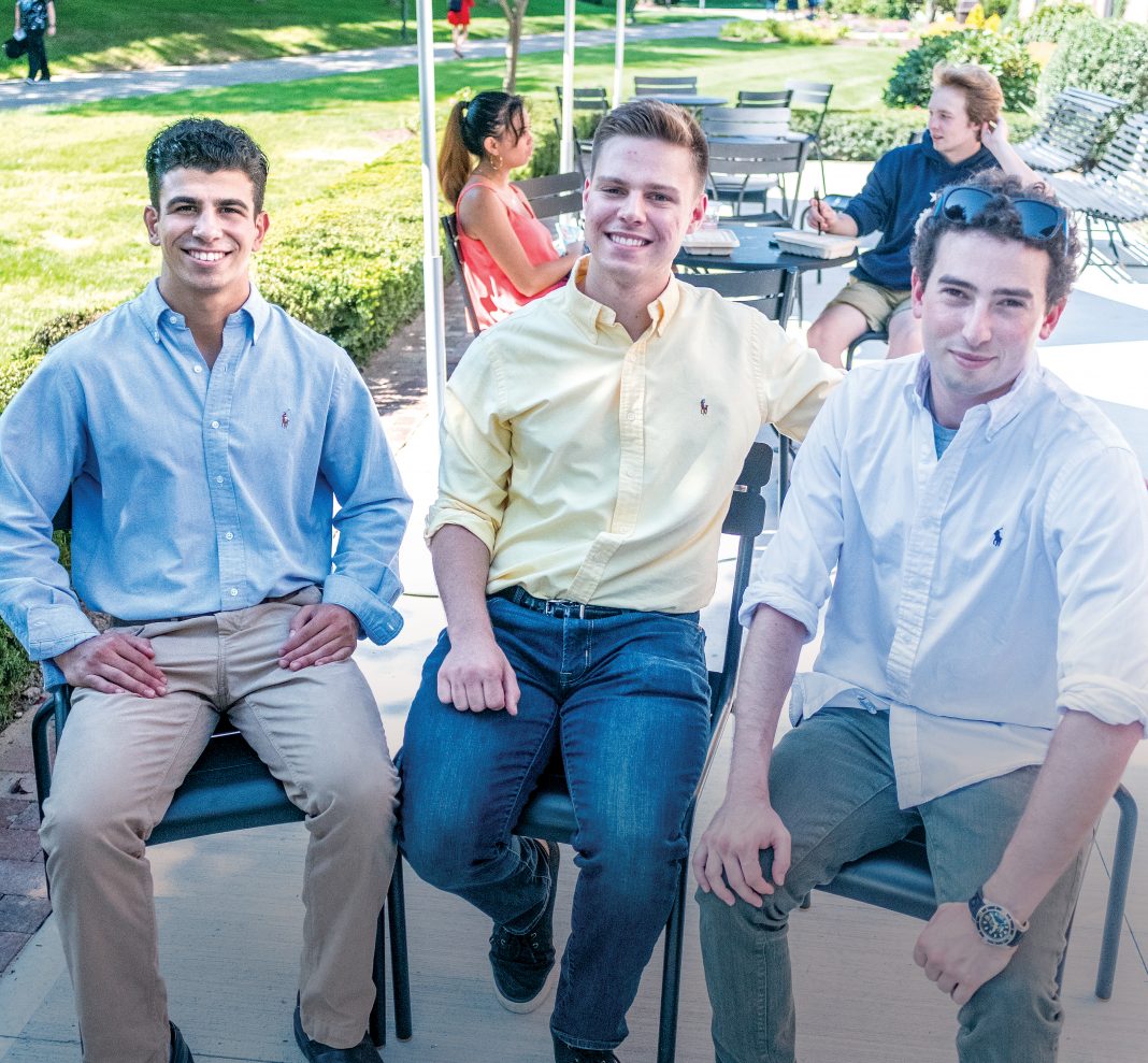 PANGEANS: Pangea.app is a startup created to link college students to gigs through an app. From left, Pangeans (users of the app) and Johnson & Wales University sophomores Marc Marasco and Jack Rittereiser with Pangea.app co-founder and CEO Adam Alpert, a Brown University graduate. In the background are JWU sophomores Deanna Tacmo, left, and Sam Farley.  / PBN PHOTO/MICHAEL SALERNO