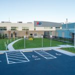 A FRESH FACE: As part of the refurbishment of Providence Water’s central operation facility on Dupont Drive, the blue-colored front entrance of the former Bank of America data and call center was updated with new signage and color scheme, as well as landscaped grass.