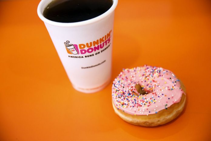 DUNKIN' BRANDS GROUP reported a 60.5 percent increase in third quarter net income year over year to $66.1 million. / BLOOMBERG FILE PHOTO/PATRICK T. FALLON