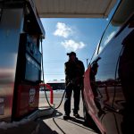 RHODE ISLAND regular gas prices declined 1 cent to average $2.81 per gallon this week. / BLOOMBERG NEWS FILE PHOTO/DANIEL ACKER