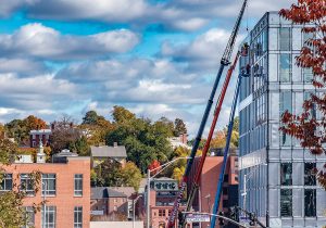 ONGOING CONSTRUCTION: Pictured at right is ongoing construction of the Wexford Innovation Center along Richmond Street in the Jewelry District of Providence, with the older buildings of the neighborhood behind at left.  / PBN PHOTO/MICHAEL SALERNO