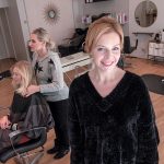 CREATIVE STYLISTS: Leah Carlson, right, is a master stylist/colorist and the owner of La La Luxe salon, with locations in Providence and Warren. In the background is Jenna Frerichs of Providence having her hair styled by Tara McCabe.  / PBN PHOTO/MICHAEL SALERNO