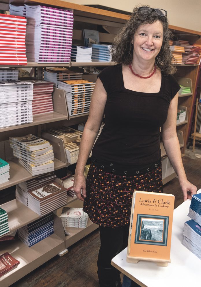 FRESH START: Anne Wolfe is the owner of Bear Wallow Books in Providence. The company had been owned by her parents in Indiana but after the death of her father, Wolfe bought her mother out of the company and moved it to Providence. / PBN PHOTO/MICHAEL SALERNO