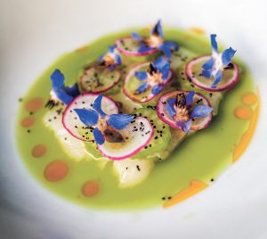 BLOCK ISLAND BASS: Raw Block Island striped bass, with green vegetable gazpacho, salsa, a’gallega and poppy seeds.  / COURTESY GRACIE’S VENTURES INC.