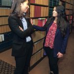 JUDICIOUS EXPERIENCE: Dorca M. Paulino, left, diversity director at the R.I. judiciary, talks with her recent recruit, University of Rhode Island graduate Sharon Santiago. / PBN PHOTO/MICHAEL SALERNO