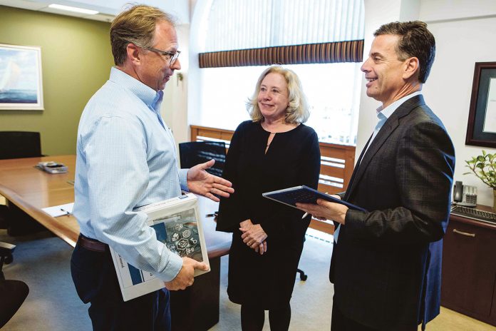 INCREASED INTEREST: Carey, Richmond and Viking Insurance, a broker in Middletown, said inquiries and discussions from small to midsized businesses about cyber insurance coverage are up 10 to 20 percent since last year. From left, Jeff Boldt, director of commercial insurance; Irene Leary, marketing manager; and David Andrade, president.  / PBN PHOTO/RUPERT WHITELEY