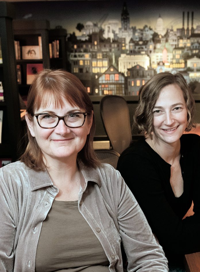 GATHERING PLACE: Anne Holland, left, founder of the What Cheer Writer’s Club, with Jodie Vinson, program manager. Holland started the club because she wanted a place where local writers of all sorts could work, network and collaborate.  / PBN PHOTO/MICHAEL SALERNO