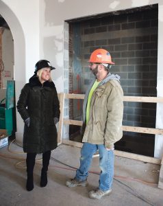 OVERSEEING TRANSITION: Tuni Schartner, director of entrepreneurship and innovation for Innovate Newport, speaks with Tom Jackman, the field superintendent for Pezzuco Construction, the general contractor for the renovation work to transform a former school building into a business incubator. / PBN PHOTO/KATE WHITNEY LUCEY