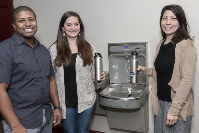 THE UNIVERSITY OF RHODE ISLAND has implemented a new campuswide program that encourages students to fill reusable bottles and save on charges at campus-based shops. From left: Olavo Goncalves, assistant director of the campus store; Alyssa Galuska, a bookstore clerk; and Marsha Garcia, campus sustainability officer. / COURTESY UNIVERSITY OF RHODE ISLAND/MICHAEL SALERNO