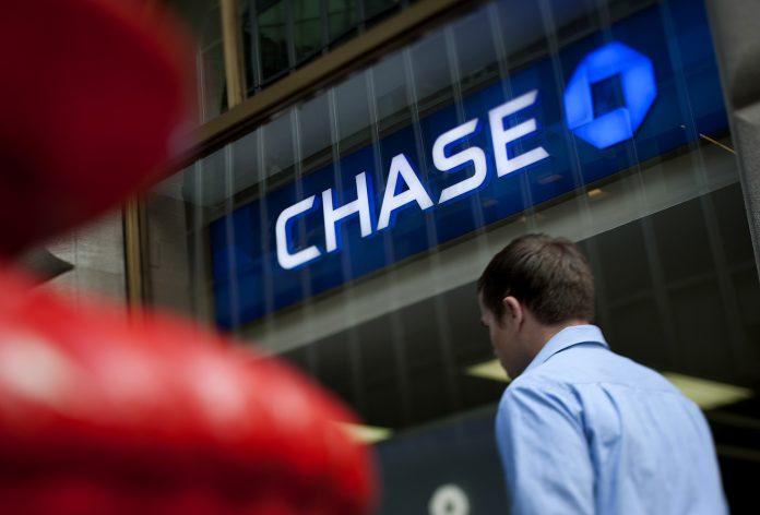 JP MORGAN CHASE said Friday it will open 12 retail bank branches in Greater Providence and Rhode Island, with the first branch opening in June in Providence. / BLOOMBERG NEWS FILE PHOTO/SCOTT FELLS